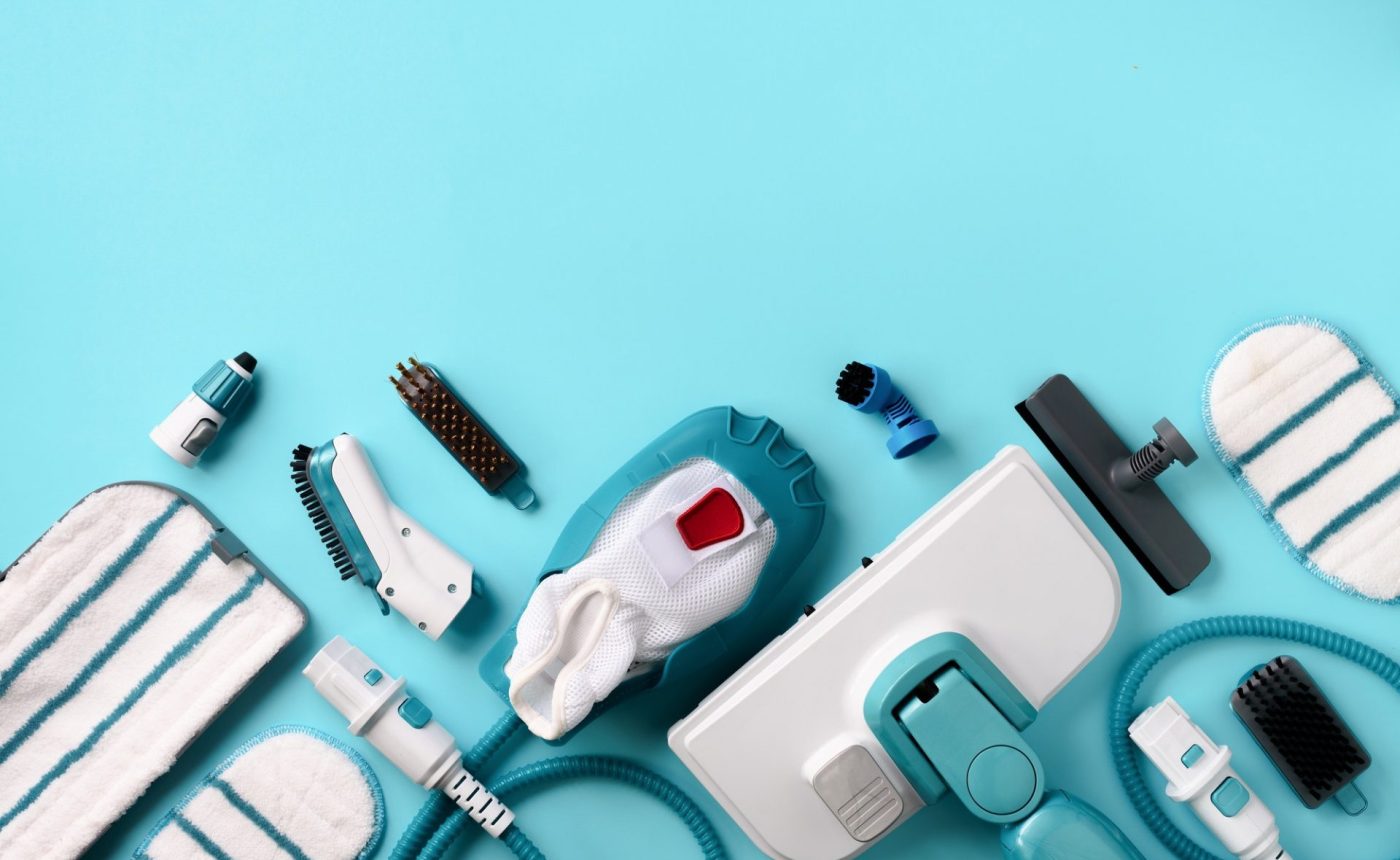 kit-of-modern-professional-steam-cleaners-on-blue-background-top-view-flat-lay-banner-with-copy-e1612928932463.jpg